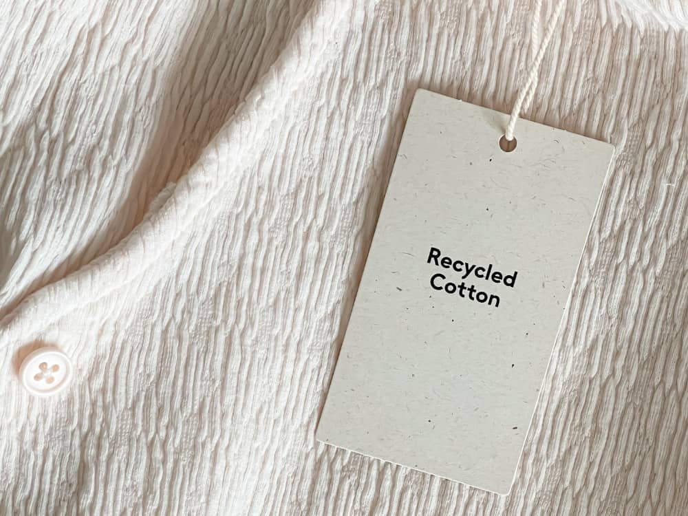 A close-up image of a garment made from recycled cotton, showcasing its sustainable and eco-friendly attributes.