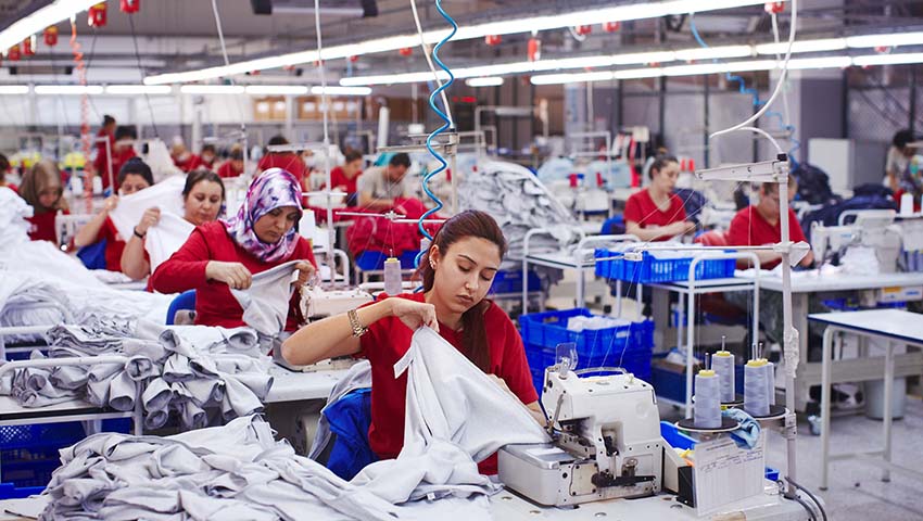 workers engaged in ethical manufacturing practices, prioritizing fairness, sustainability, and responsibility.